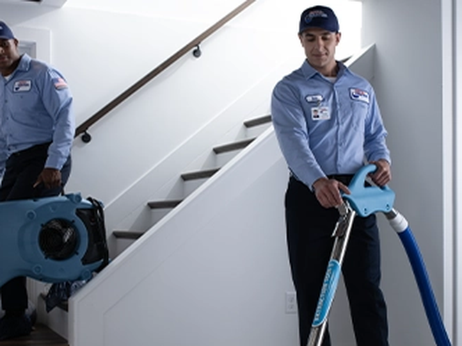 Roto-Rooter Plumbing & Water Cleanup — Water Damage Restoration crew at work in Jersey City, NJ